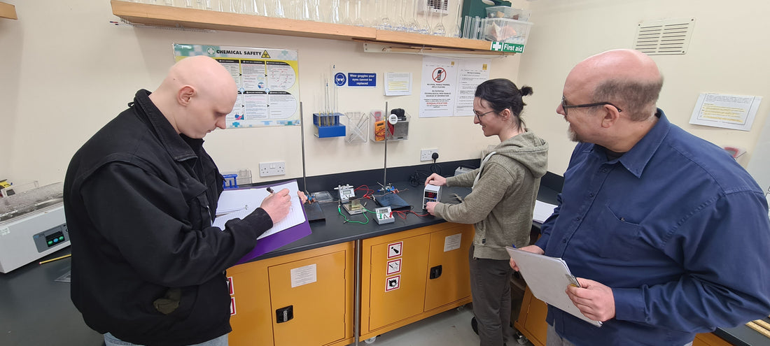 A-Level Physics student working with a teacher during a practical endorsement session at Exam Centre Birmingham