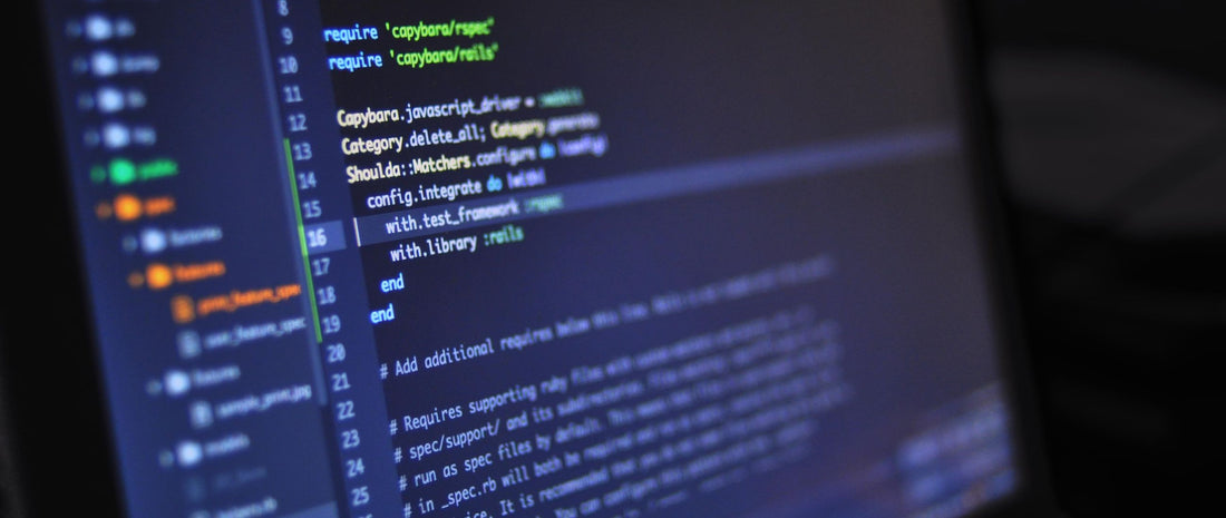 Close-up of colourful programming code on a laptop screen, representing the Computer Science exams sat by GCSE, IGCSE, AS and A-Level private candidates